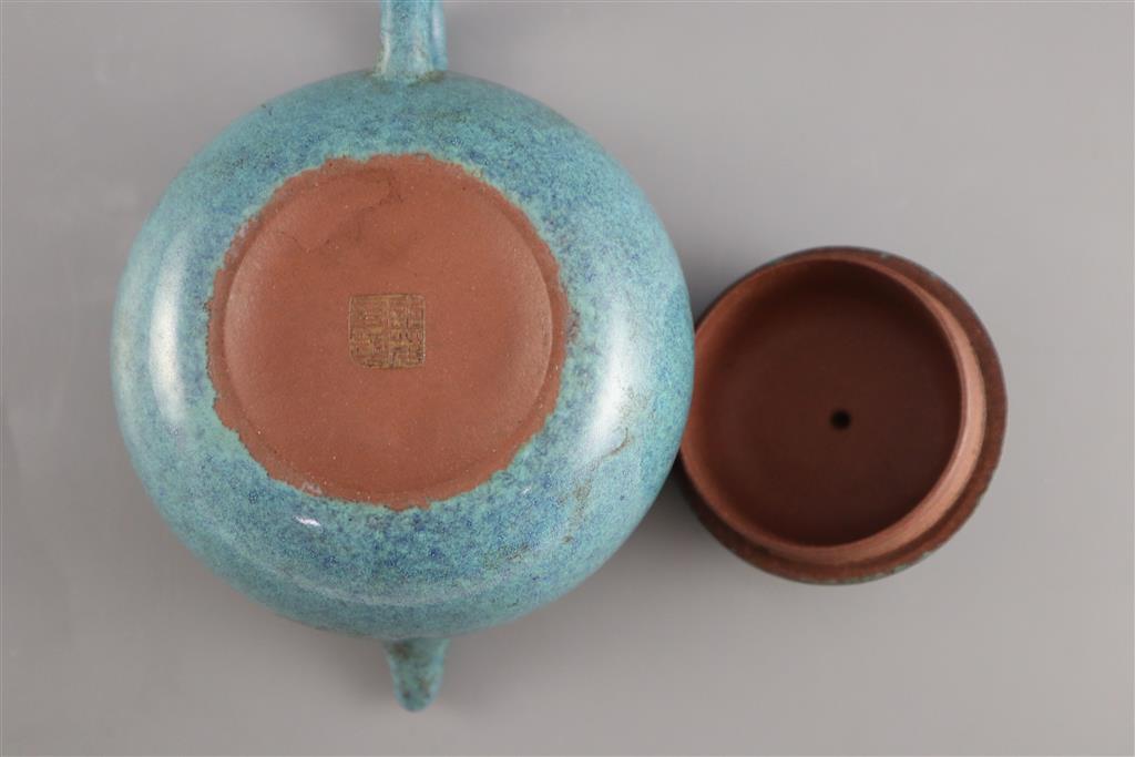 A Chinese Yixing robins-egg glazed compressed globular teapot and cover, Qing dynasty, 17.5cm across